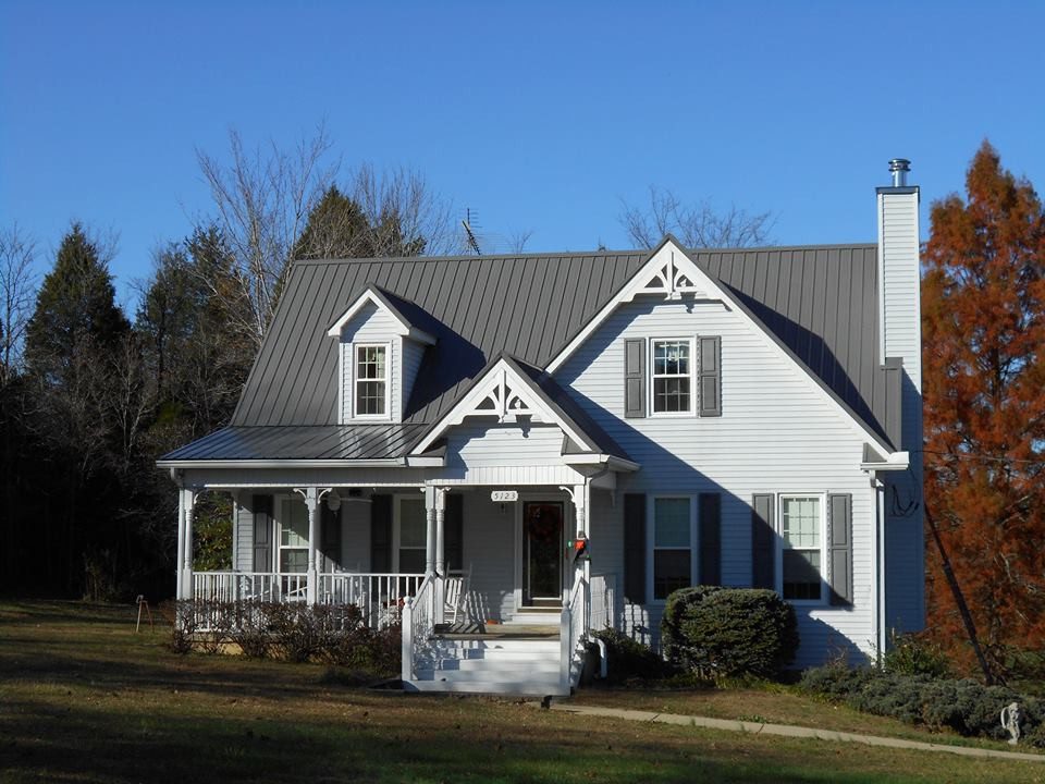 metal roofing 130 a white house with a metal roof